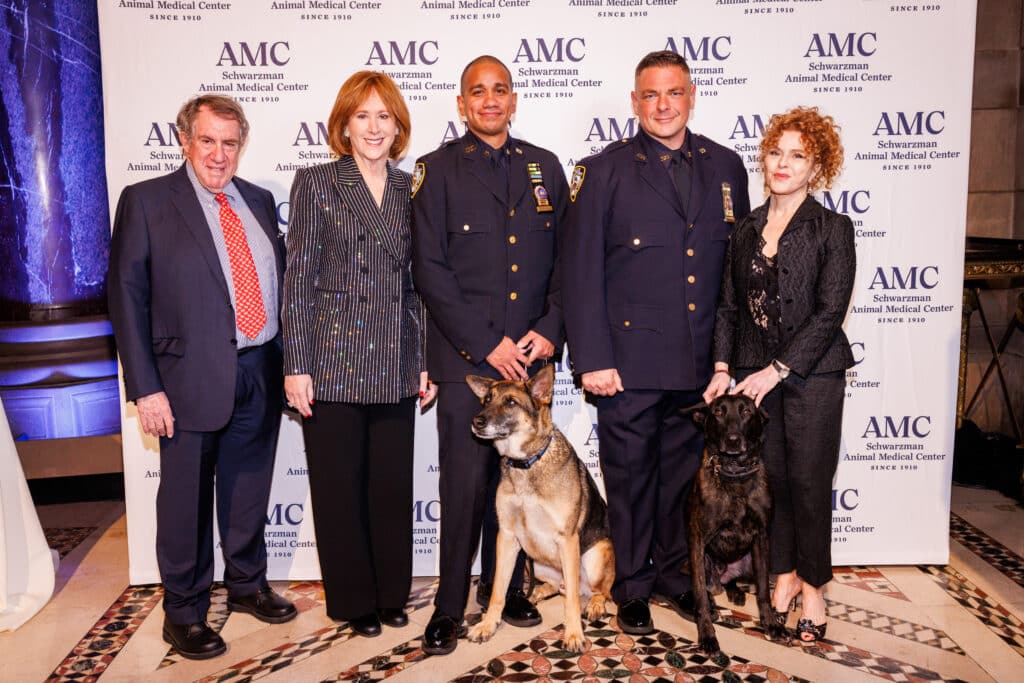 Andrew Tisch, Ann Tisch, Detective Paul Urquiaga with K9 Louie, Detective Ronald Spalazzi with K9 Mos, and Bernadette Peters