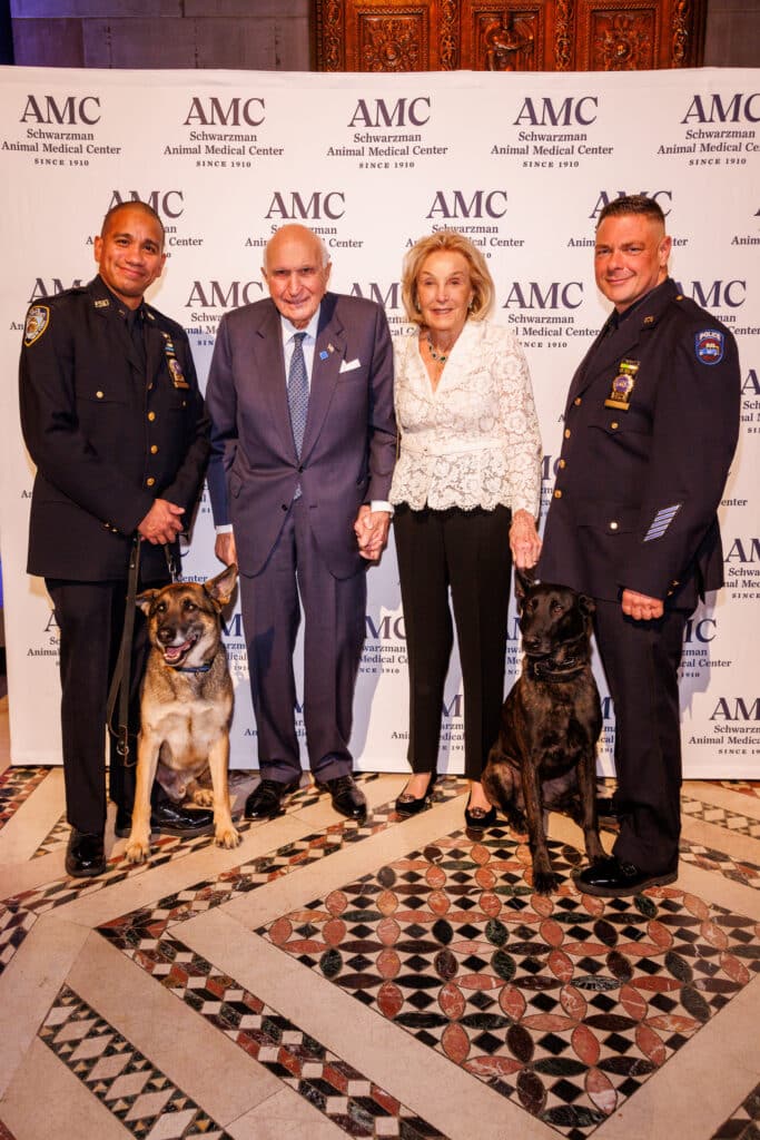 Detective Paul Urquiaga with K9 Louie, Kenneth and Elaine Langone, and Detective Ronald Spalazzi with K9 Mos