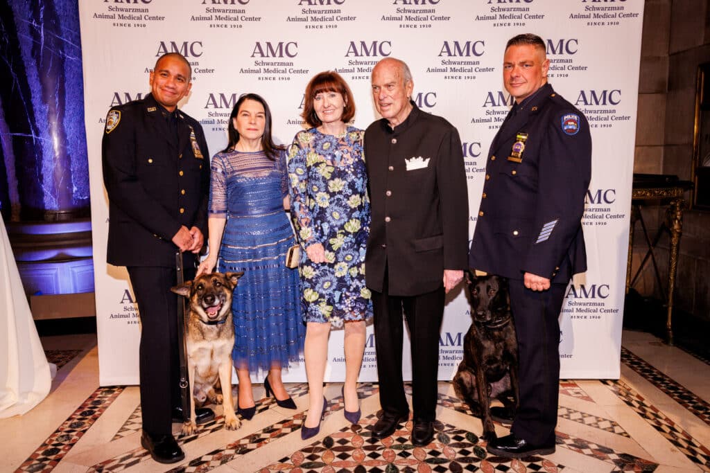 Detective Paul Urquiaga with K9 Louie, Nicole Seligman, Helen Irving, Robert Liberman, Detective Ronald Spalazzi with K9 Mos