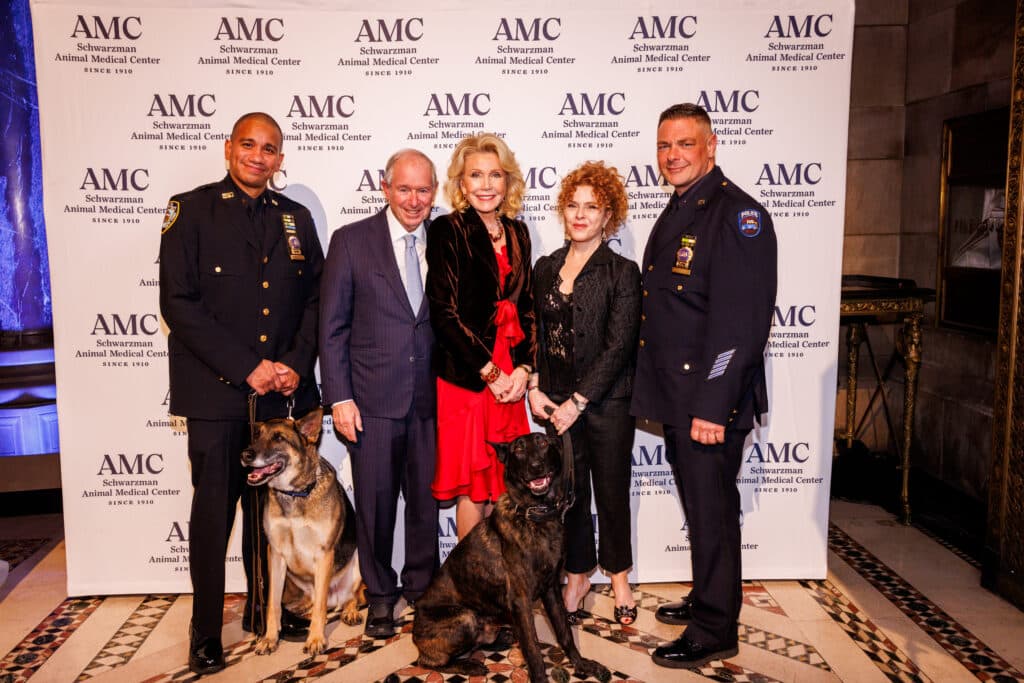 Detective Paul Urquiaga with K9 Louie, Stephen and Christine Schwarzman, Bernadette Peters, and Detective Ronald Spalazzi with K9 Mos