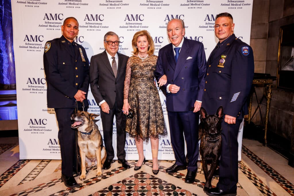 Detective Paul Urquiaga with K9 Louie, Bob Colacello, Emilia and Pepe Fanjul, and Detective Ronald Spalazzi with K9 Mos