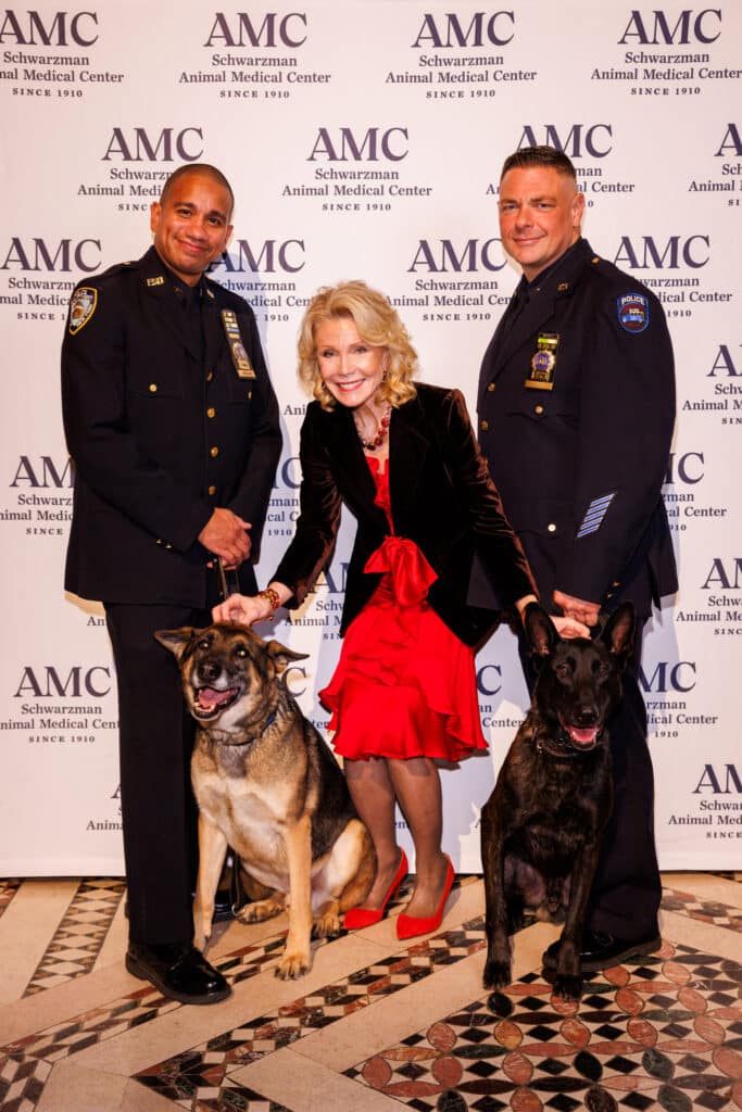 Detective Paul Urquiaga with K9 Louie, Christine Schwarzman, and Detective Ronald Spalazzi with K9 Mos