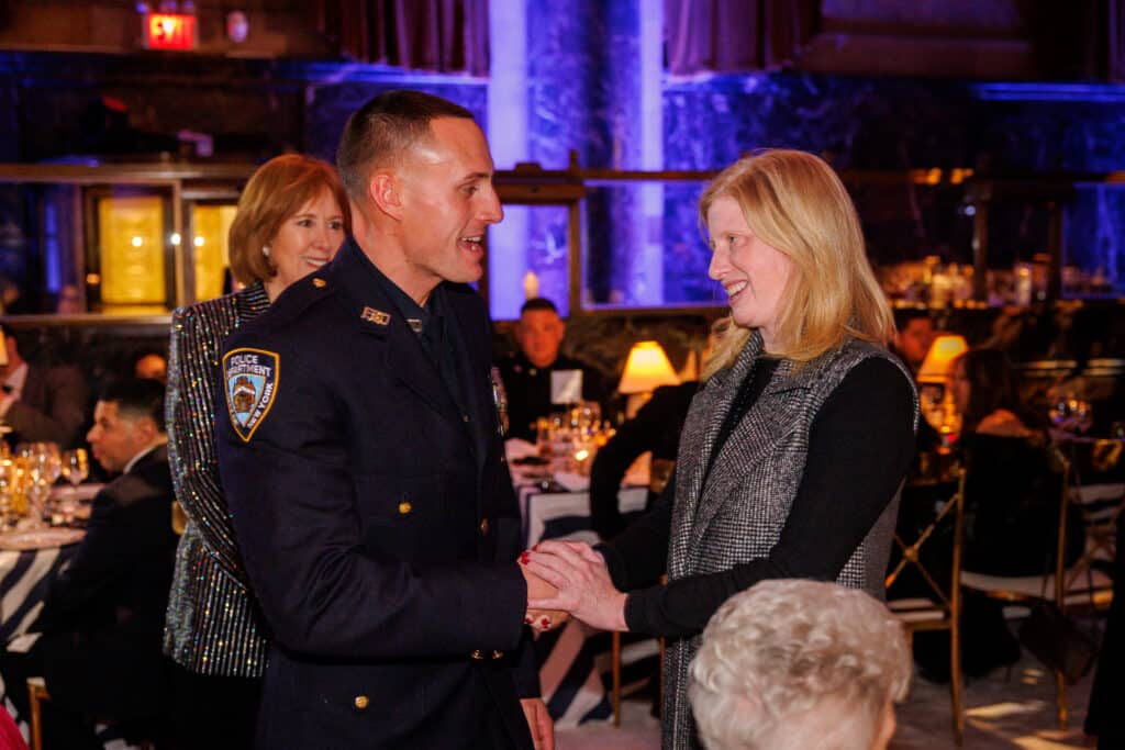 Police Officer Ryan Ferrari and NYPD Commissioner Jessica Tisch